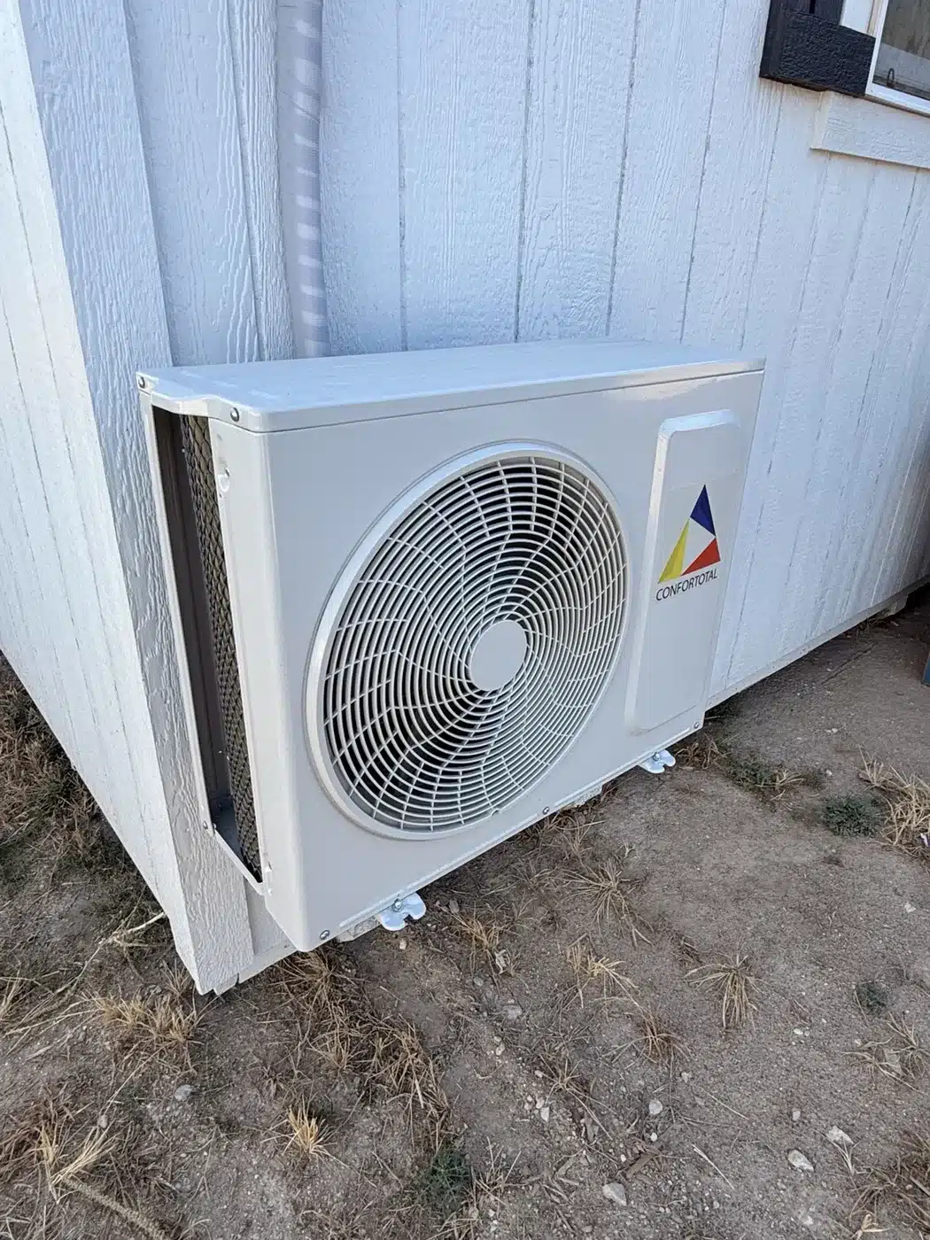 Mini-split HVAC condenser outside a Secure Storage Sheds building