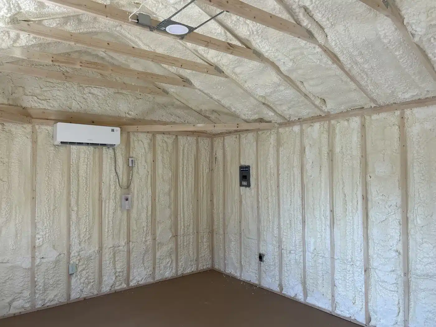 Real Secure Storage Sheds interior with spray foam, mini-split HVAC, electrical panel and recessed light installed